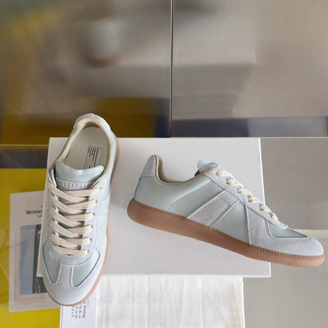 ua ma*s*n Ma*i*la mm6 sneakers